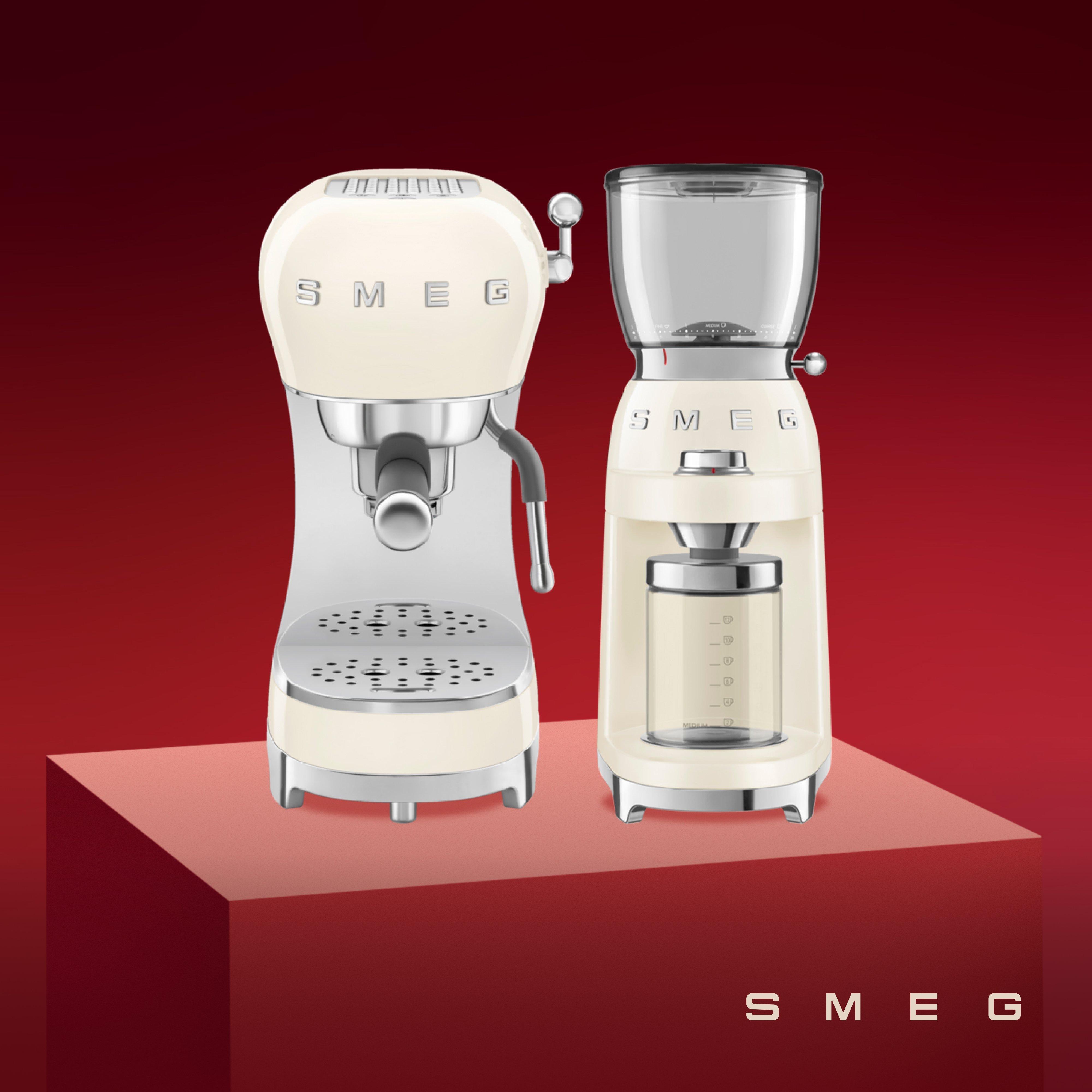 smeg machine on a red backbround and plinth