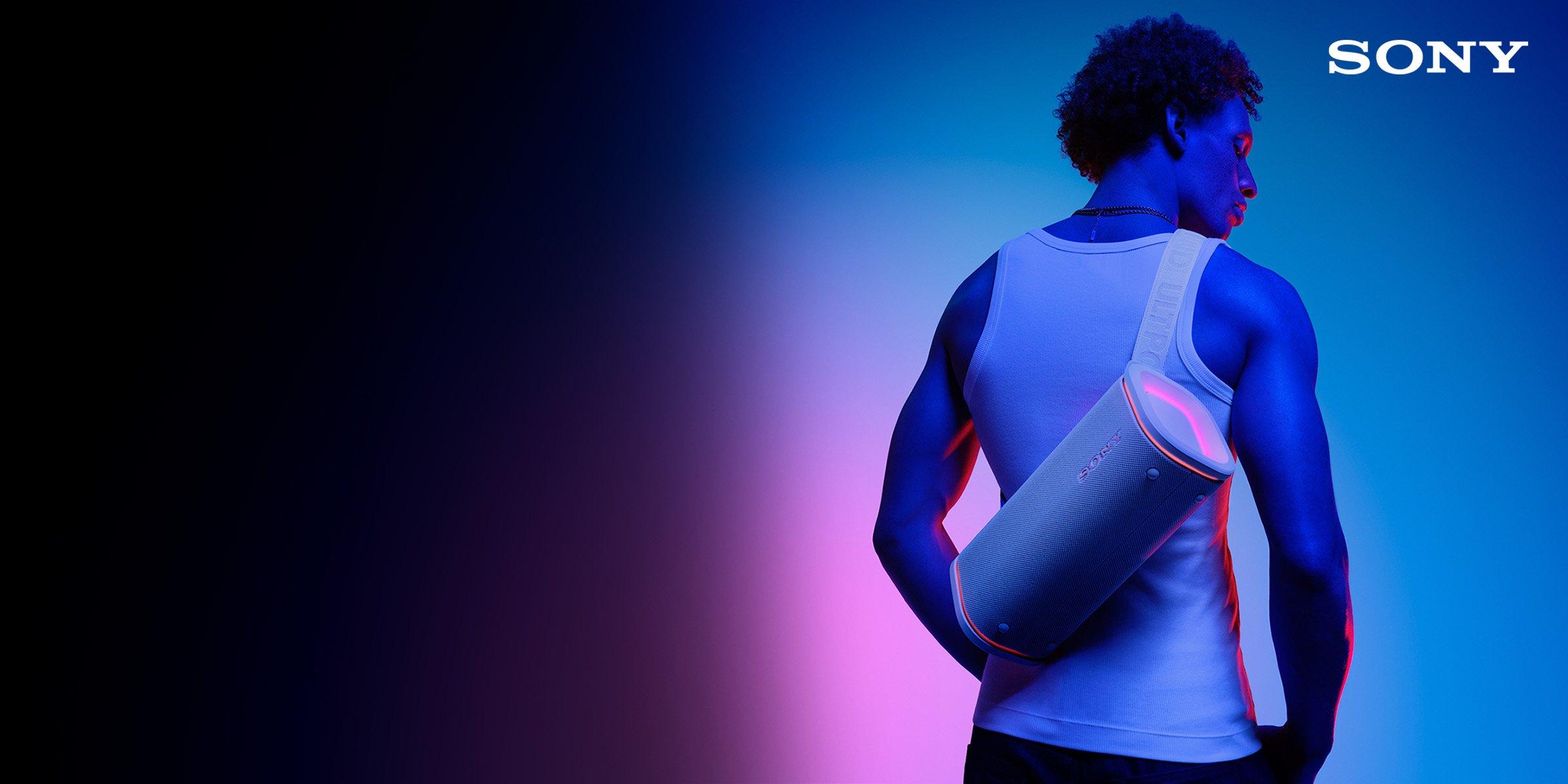 Man carry sony portable speaker on his back