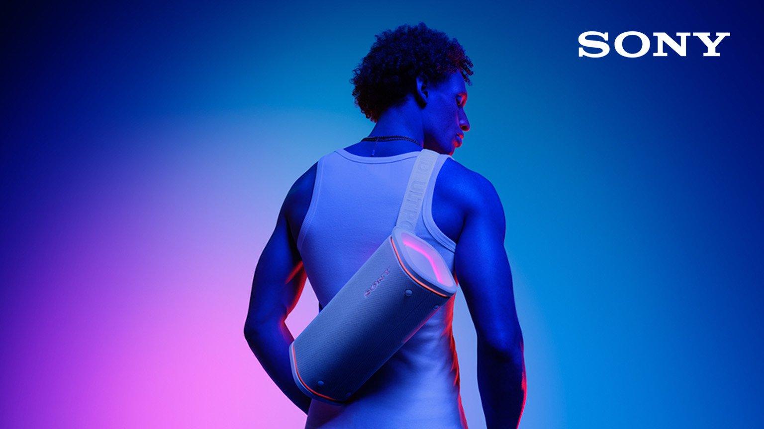 Man carry sony portable speaker on his back