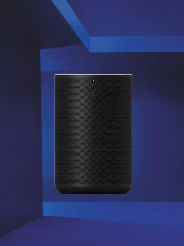 Black Sonos smart speaker against a blue geometric background, modern wireless home audio device product image
