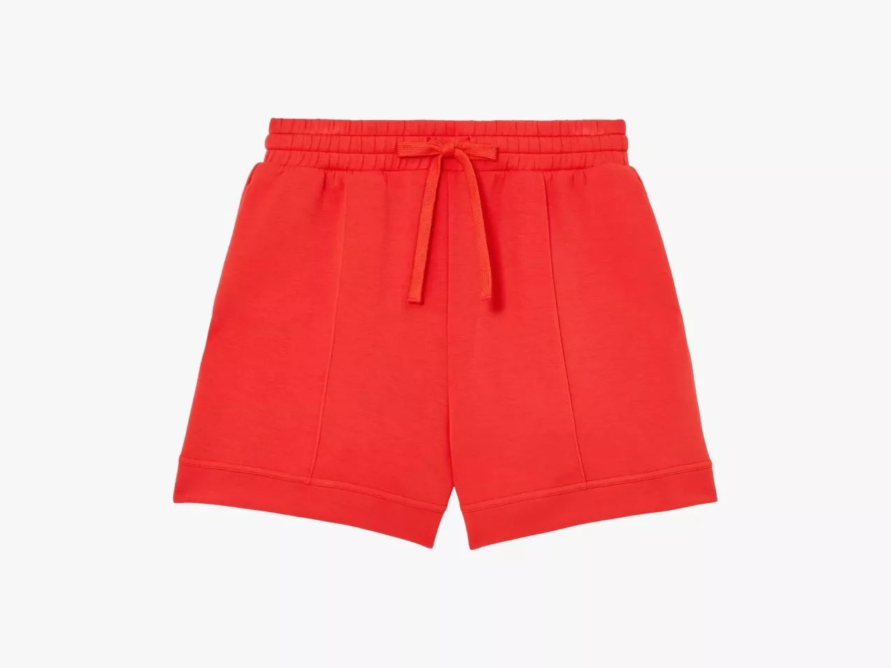 Red women’s drawstring shorts in bright coral, soft jersey fabric with elastic waistband, front seams and cuffed hem