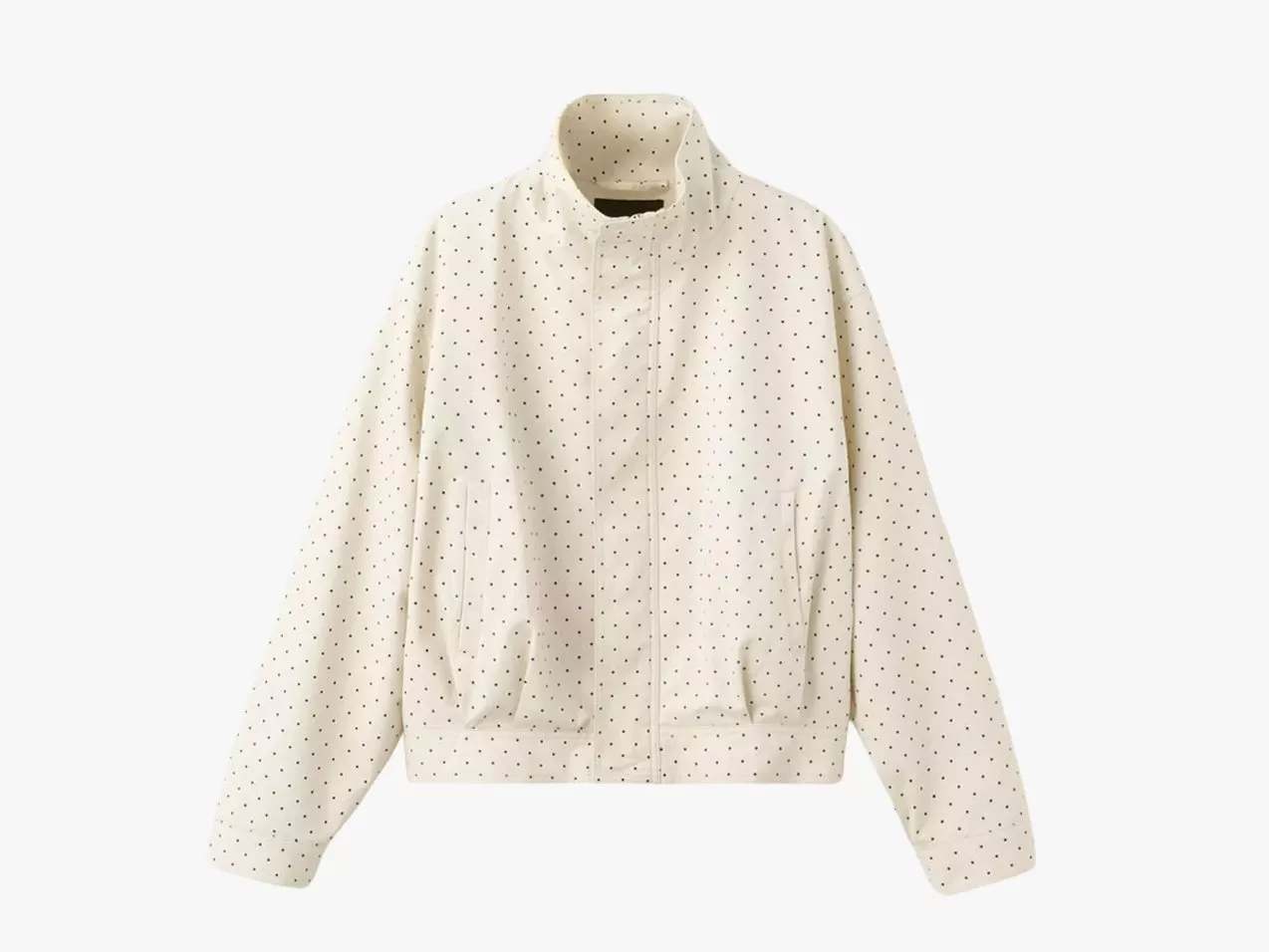 Cream polka dot zip-up jacket with high collar and pockets, lightweight casual outerwear on white background