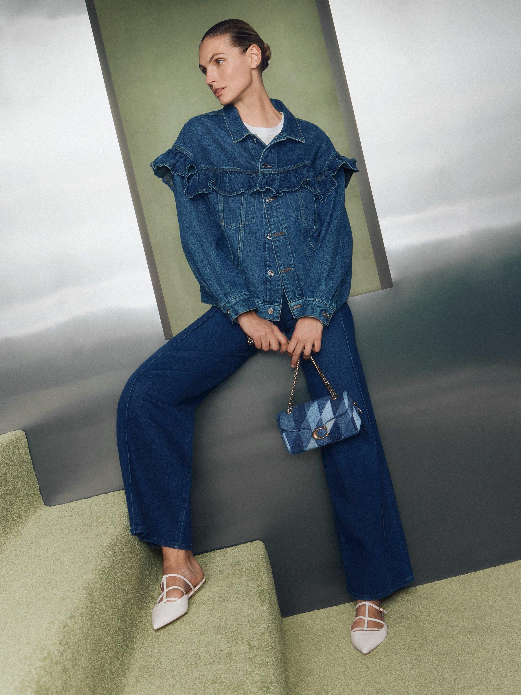 a women in head to toe in denim