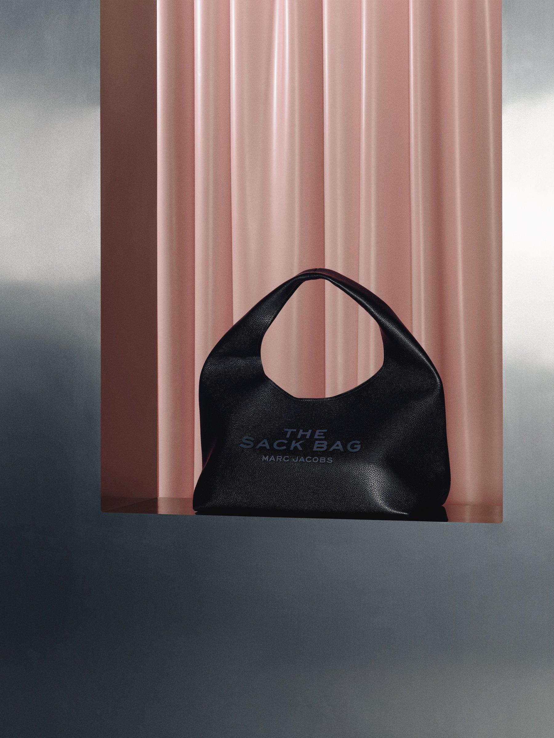 image of the sack bag by Marc Jacobs sitting on a silver chrome ledge