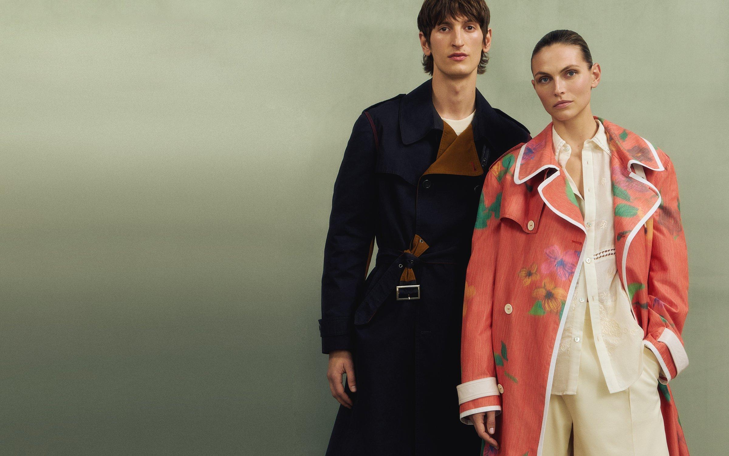 a male and female models wearing SS Daley clothing with a green background