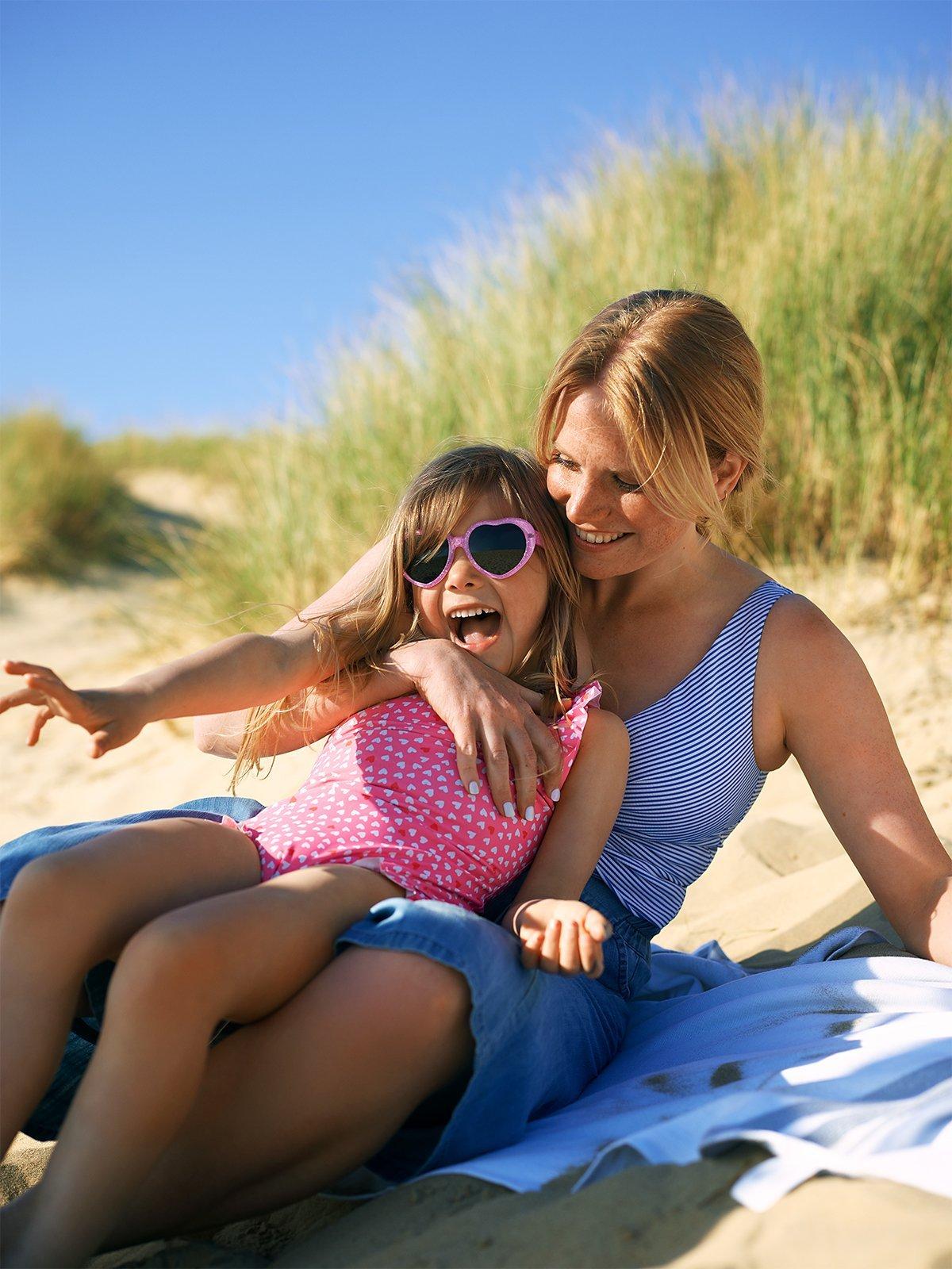 Staycation - Mother with Daughter in blue swimwear and pink swimwear