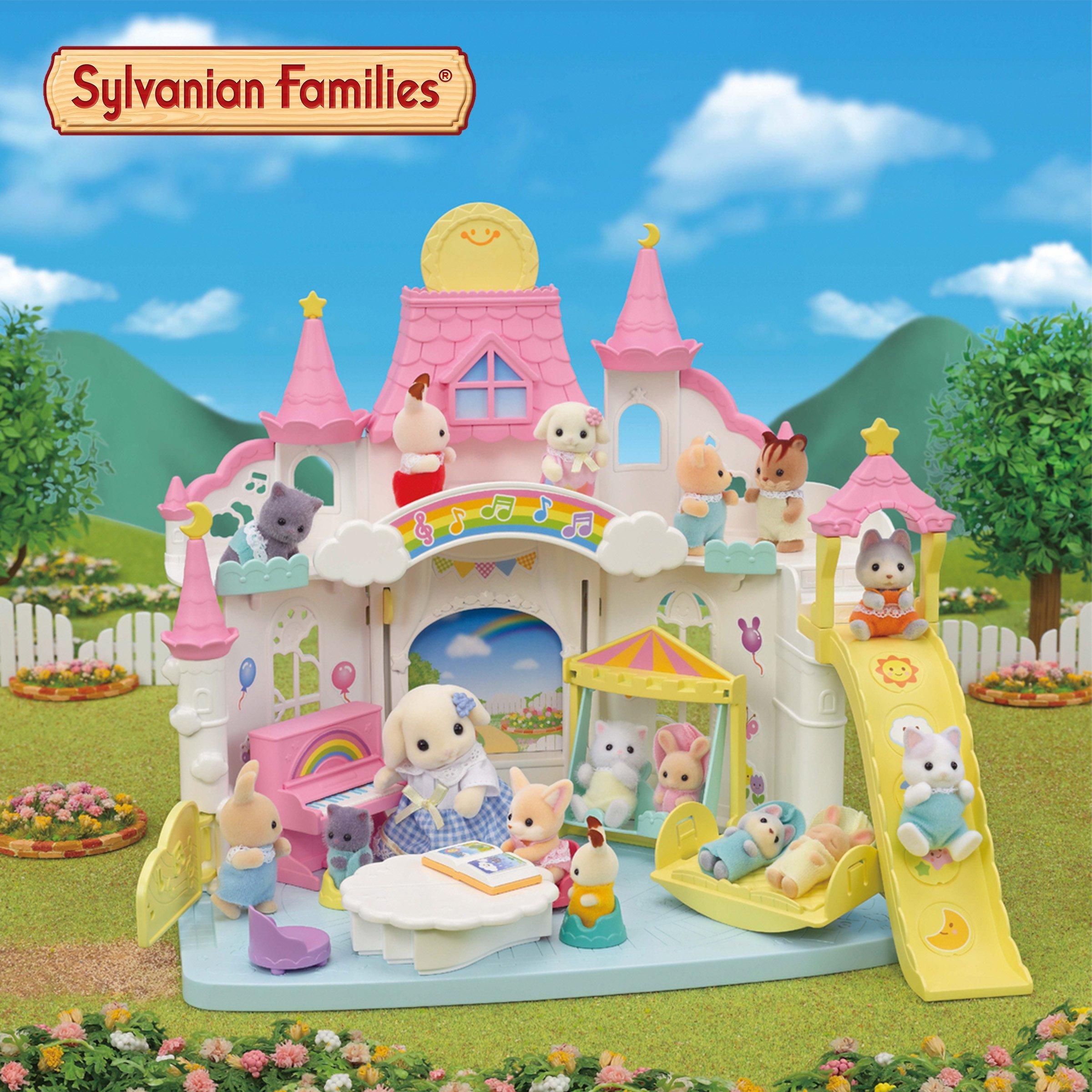 Sylvanian families toys set up around a toy house