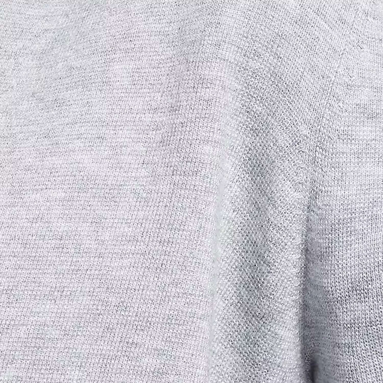 Close-up of light grey knit fabric texture, soft jersey material detail for clothing and textiles
