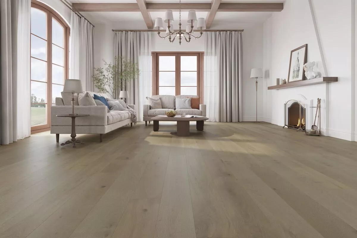 Elegant living room with wooden flooring, plush sofas, a chandelier, large windows, and a cosy fireplace.