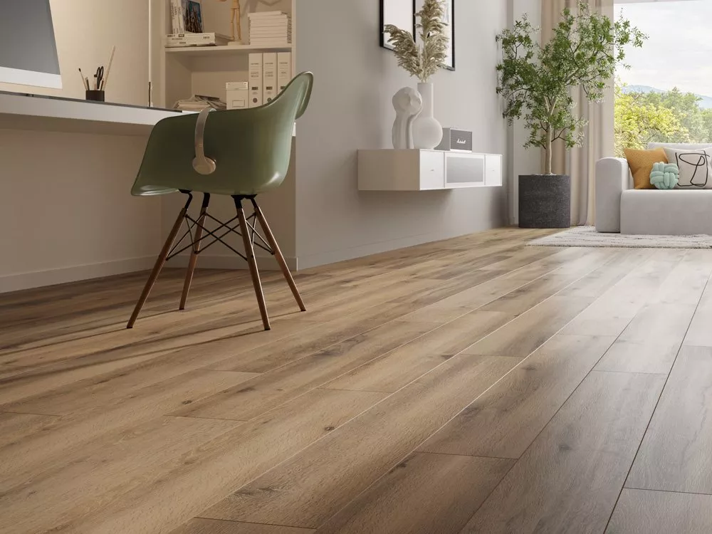 Modern home office and living room with natural oak wood flooring, green chair, and large window light