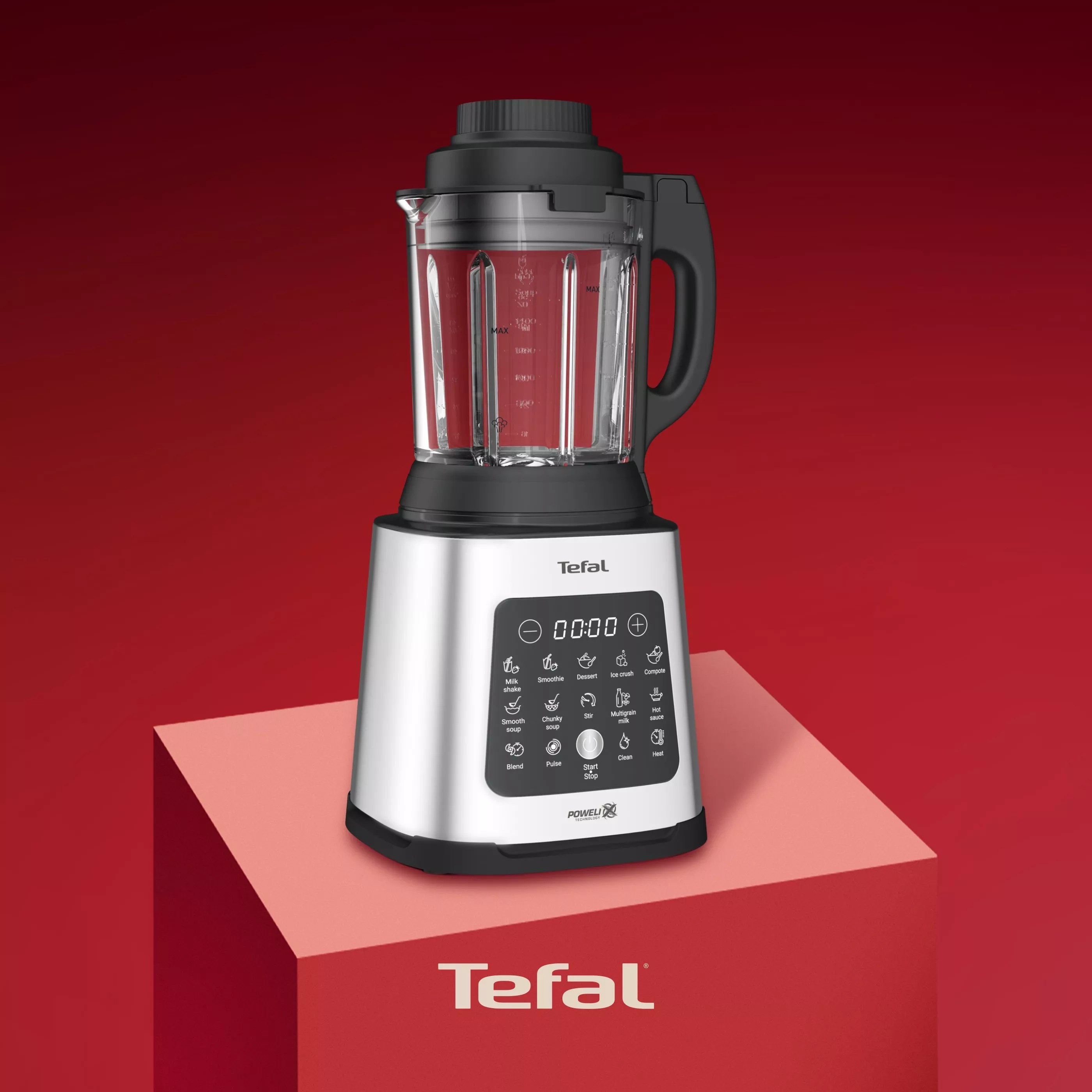 Tefal high-speed blender with glass jug and digital control panel, on red plinth against red background