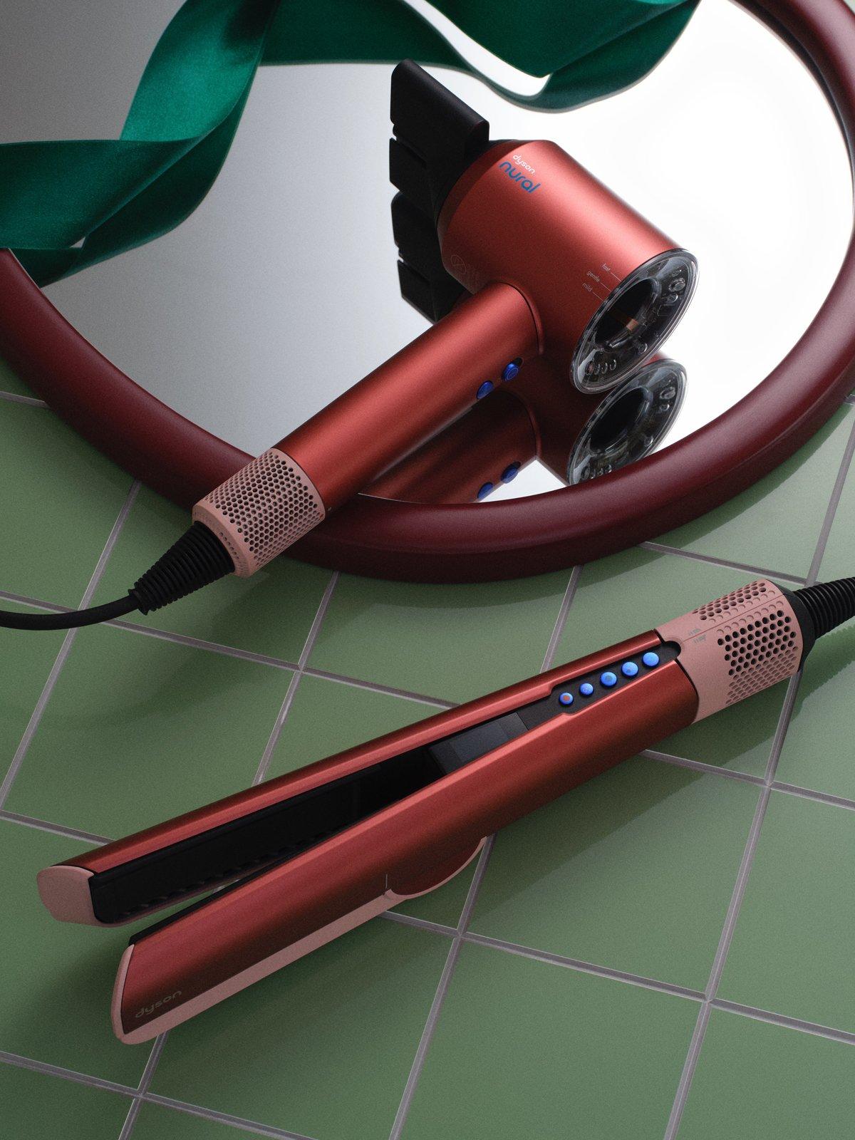 dyson products on a green tile