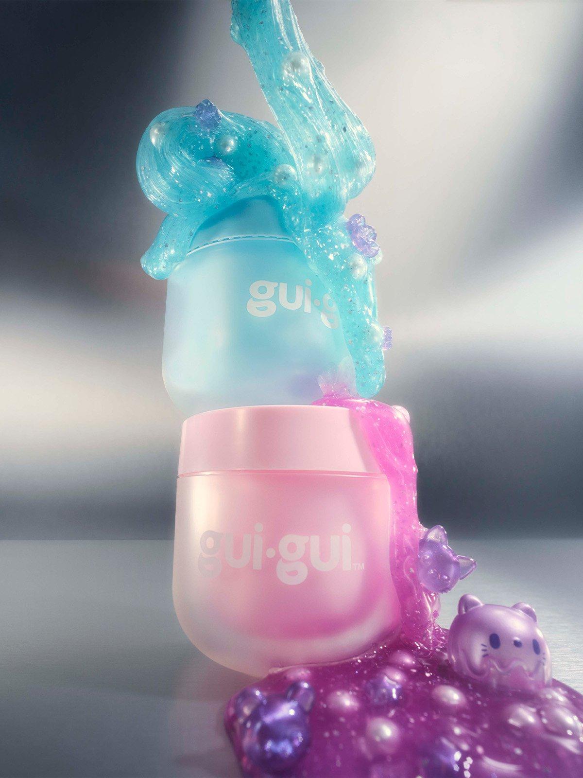Bue and pink container tubs of Gui Gui slime beauty toy