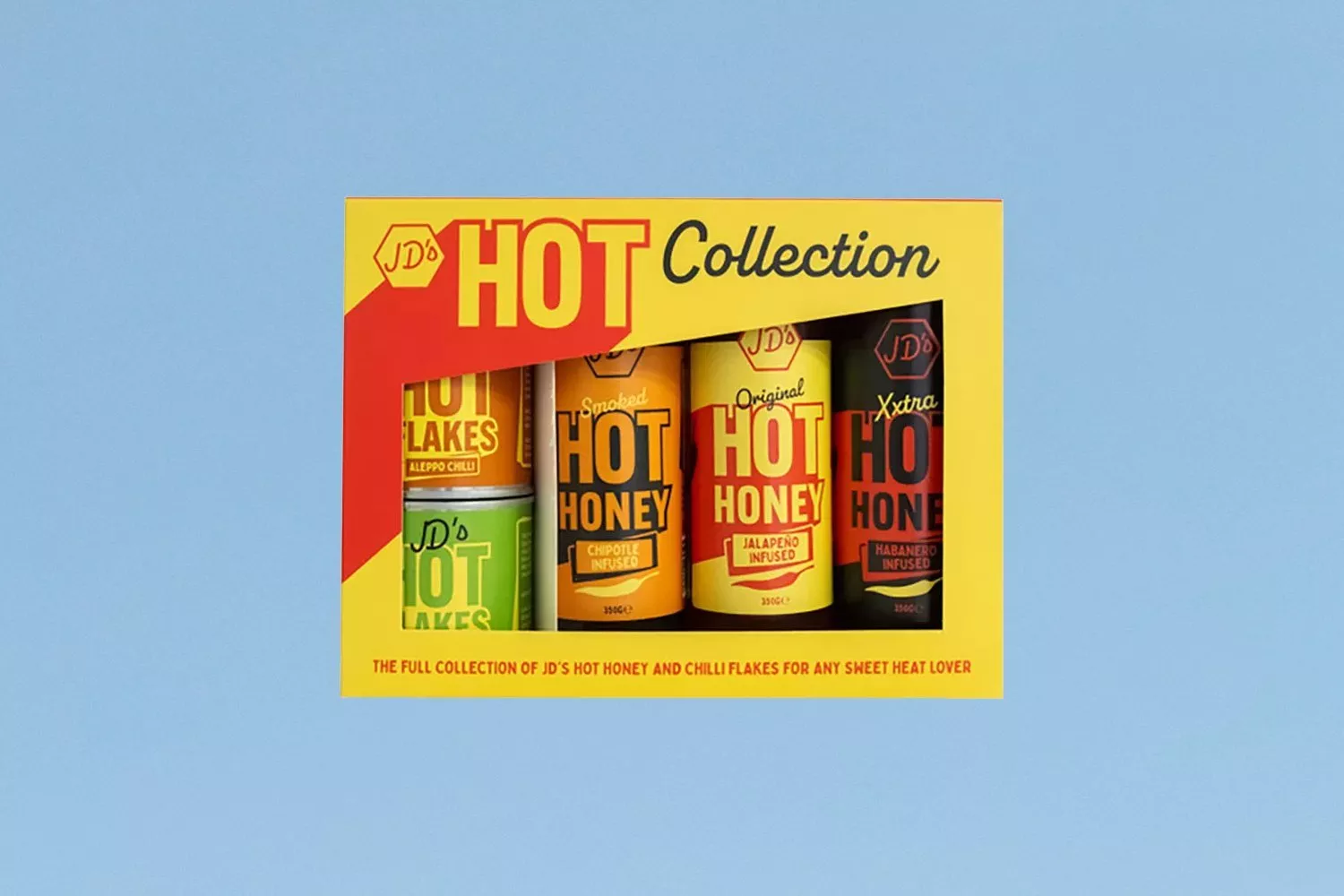 JD’s Hot Collection gift set featuring hot honey bottles and chilli flakes in colourful boxed packaging