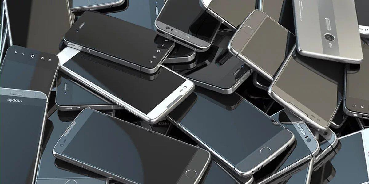 Image of loads of mobile phones stacked on-top of each other