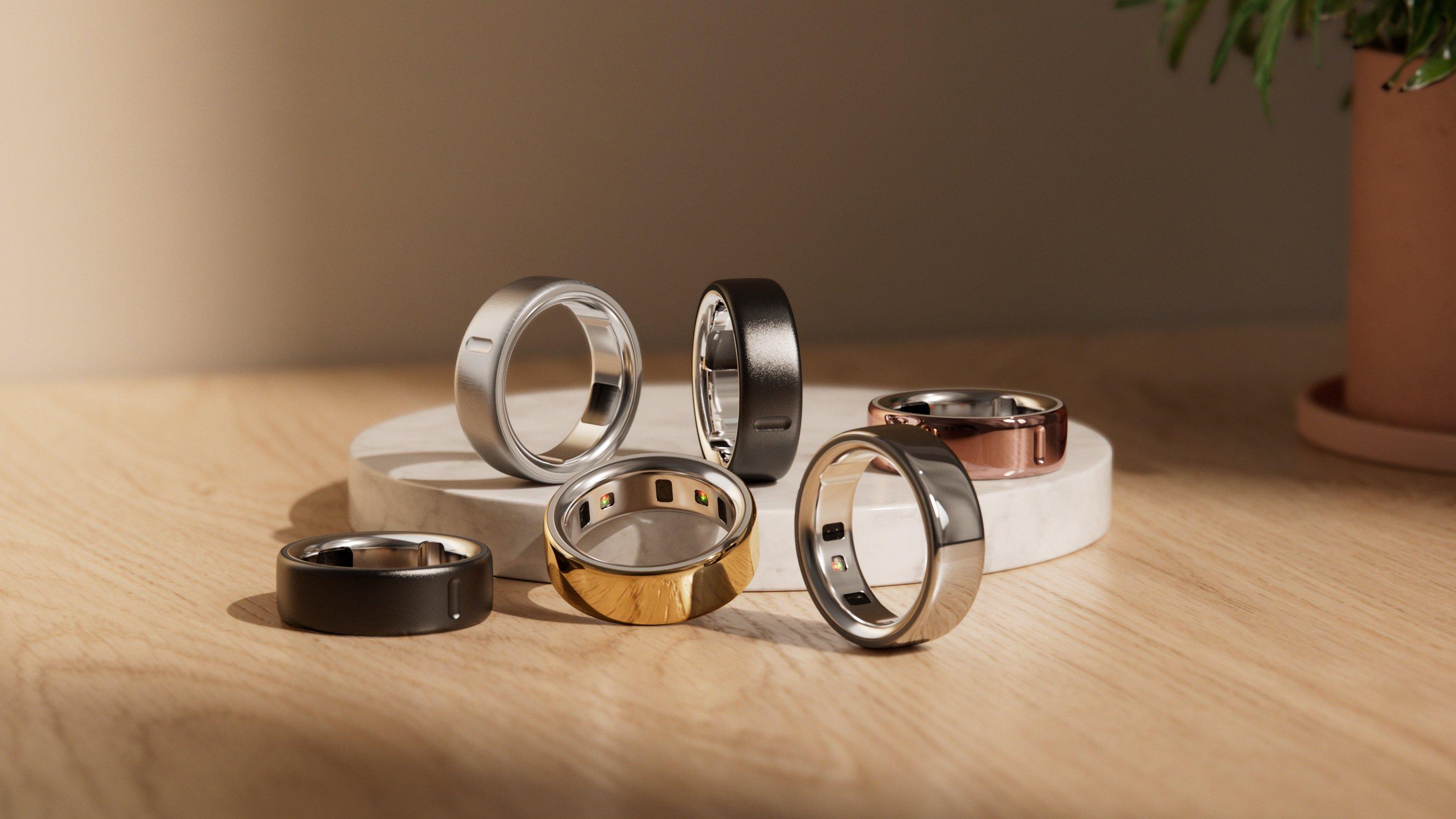 Image of the whole collection of colours of Oura rings stacked together