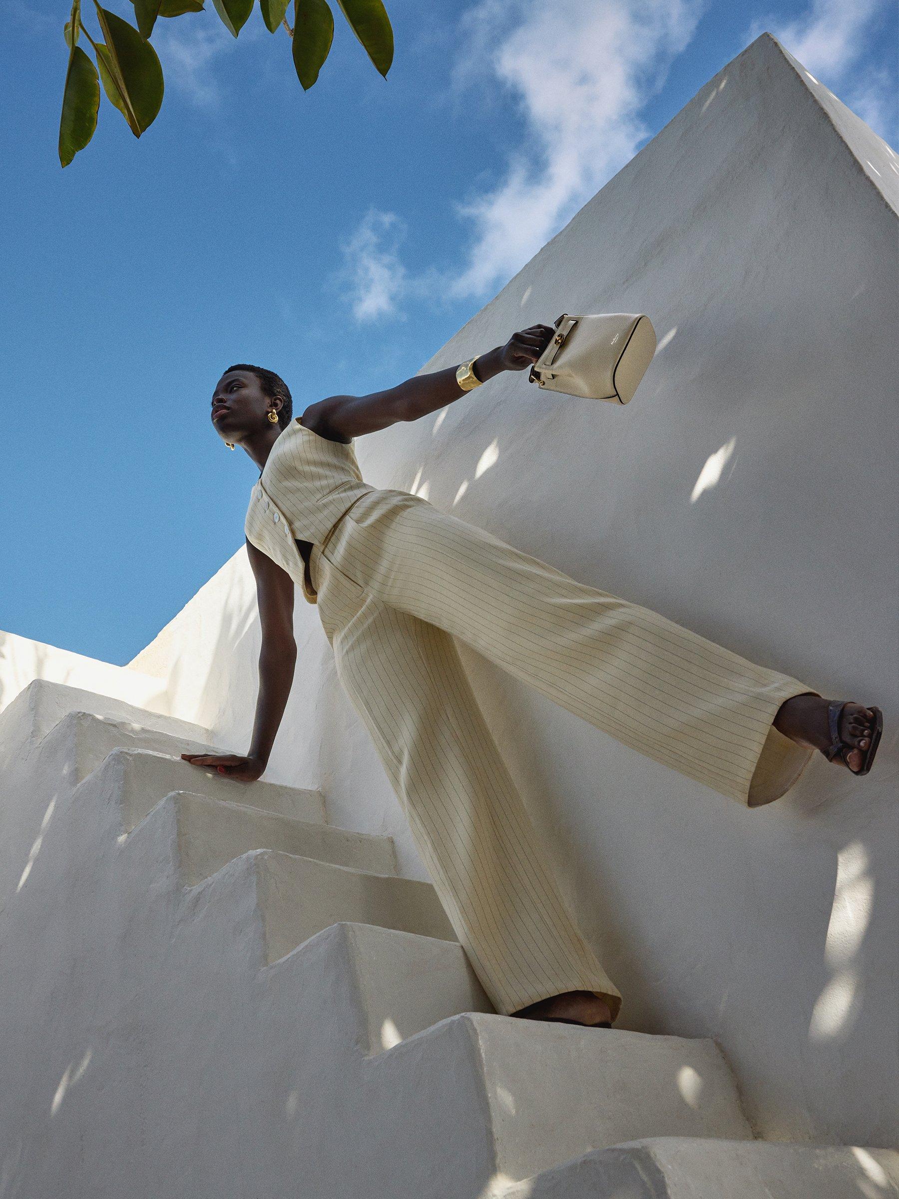 Model wearing summer co-ord suit trousers and waistcoat
