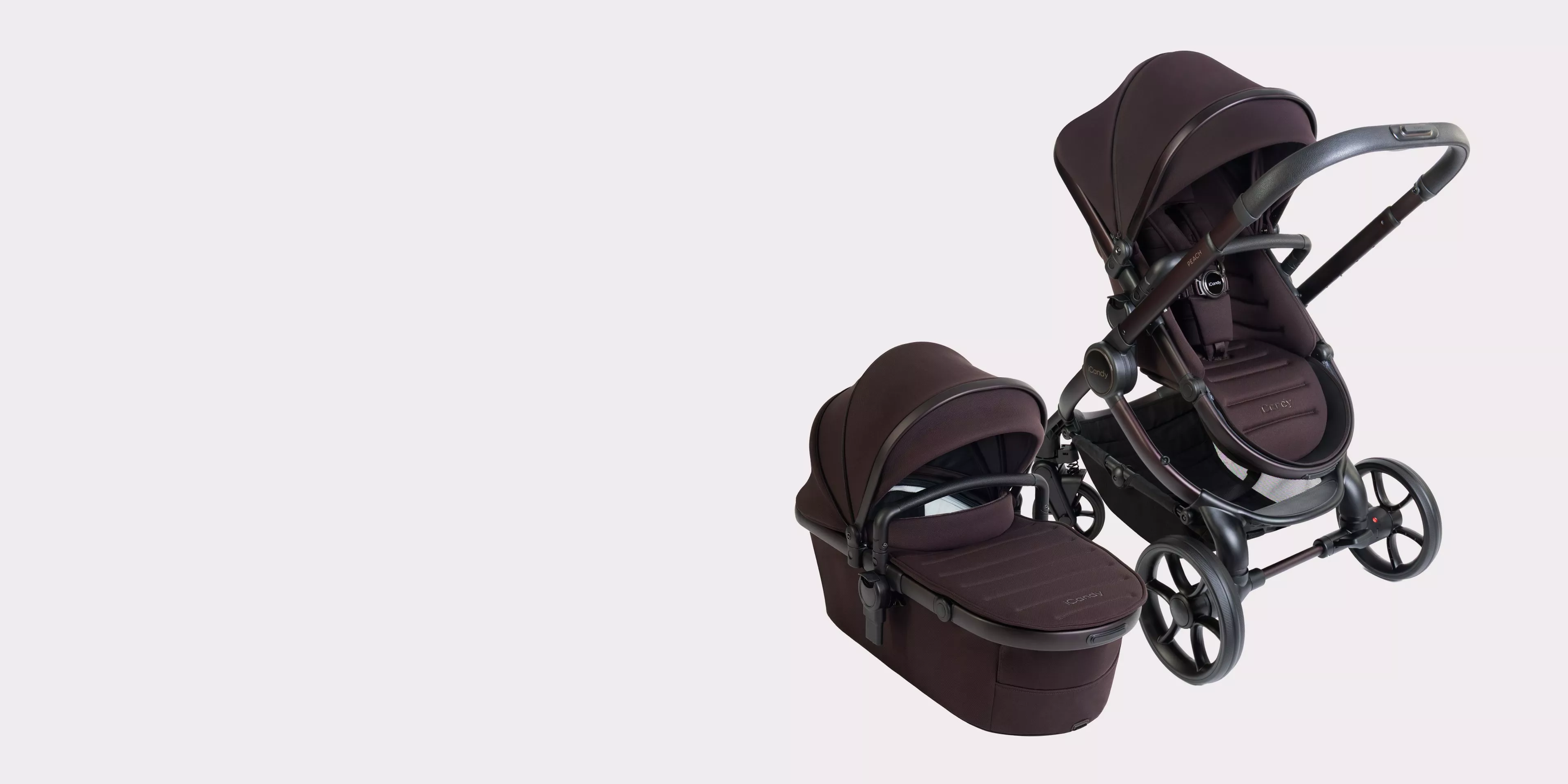 Black 2-in-1 baby travel system pushchair and carrycot pram set with adjustable seat on light background