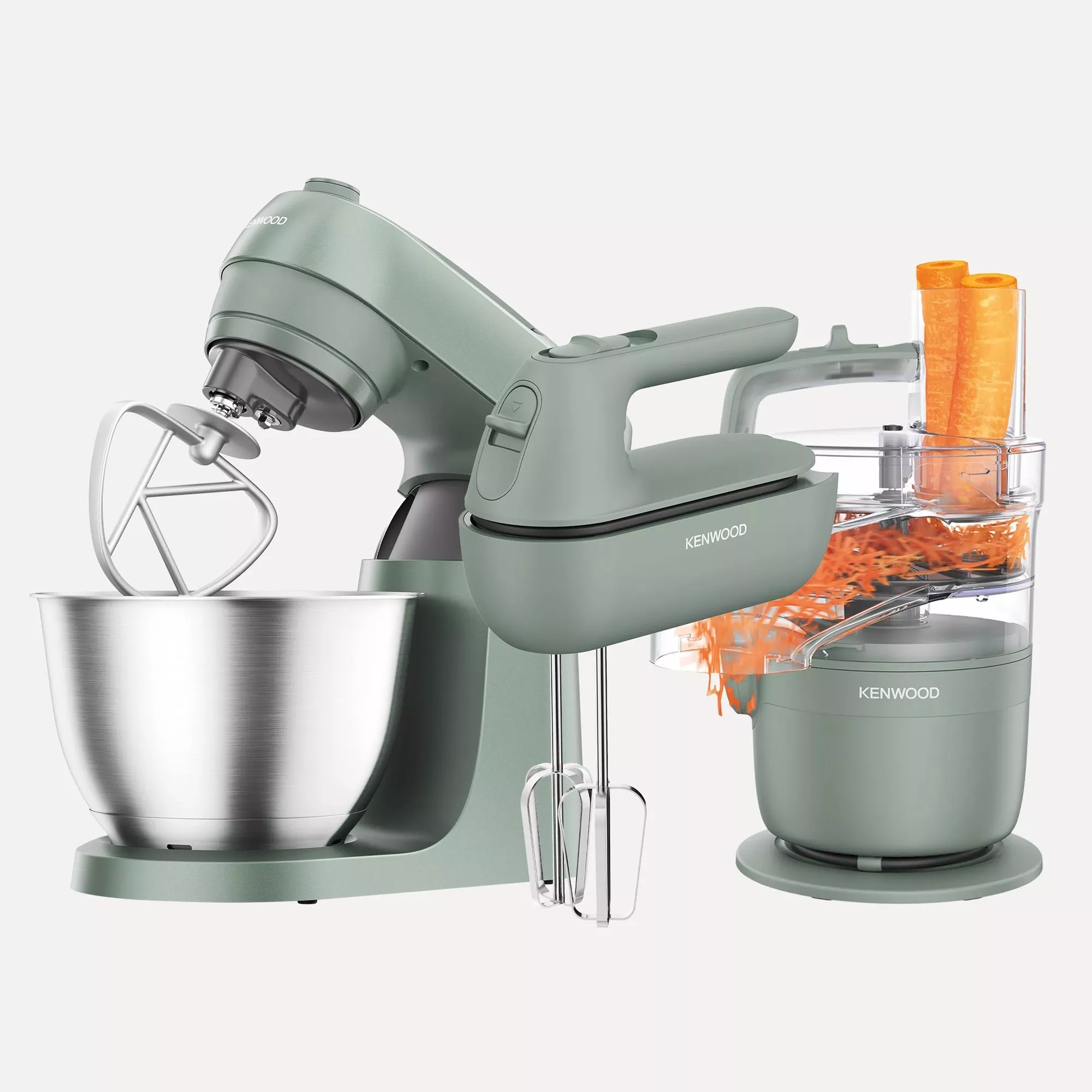 Kenwood stand mixer with stainless steel bowl, whisk and food processor attachment shredding carrots