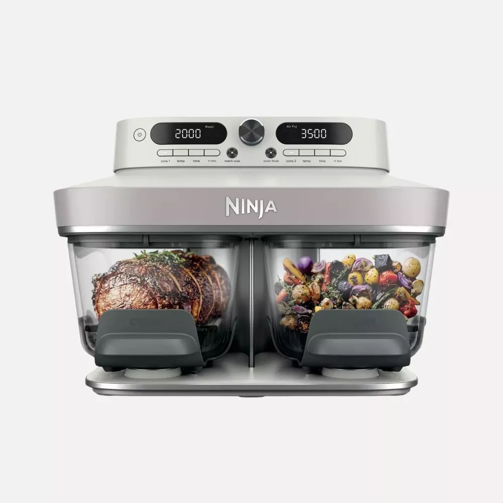 Ninja dual zone air fryer and oven with two drawers, roasting beef joint and air-frying mixed vegetables