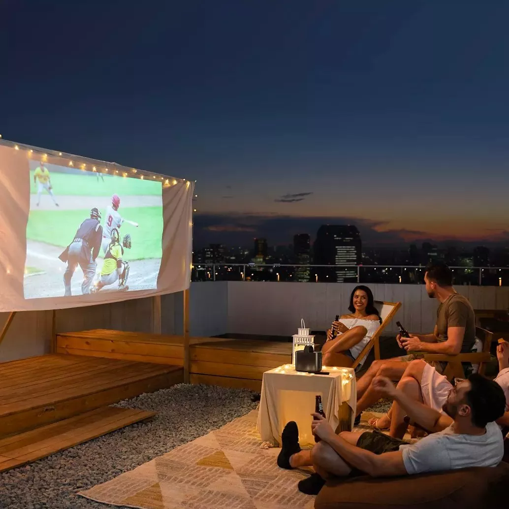 Cosy modern living room with family watching a cartoon on a wall projector, coffee table and dog on rug