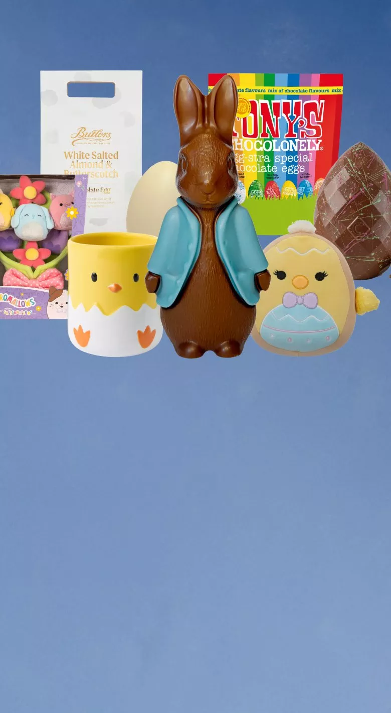 Cute bunny-themed toys and decorations on a blue background, featuring carrots and a floral wreath.