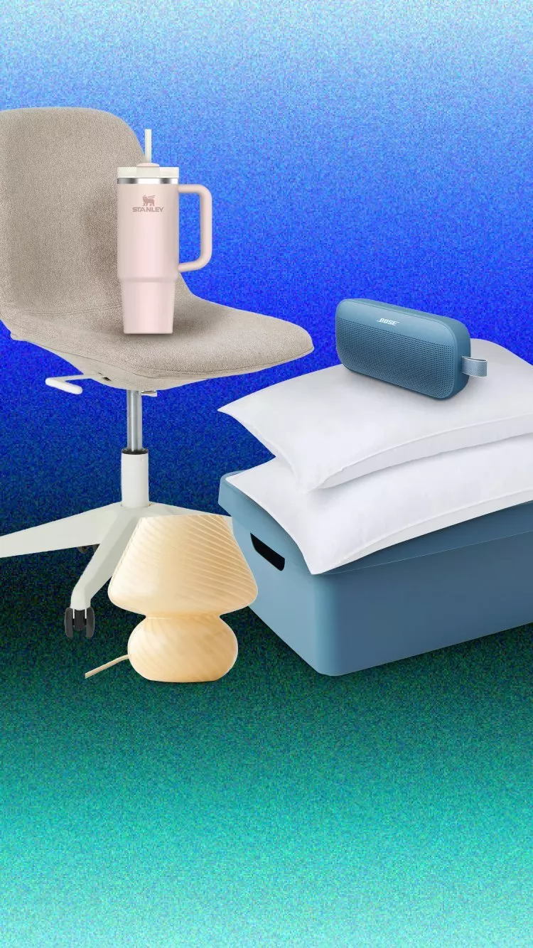 Home essentials scene with office chair, Stanley tumbler, bedside lamp, pillows and Bose speaker on storage box