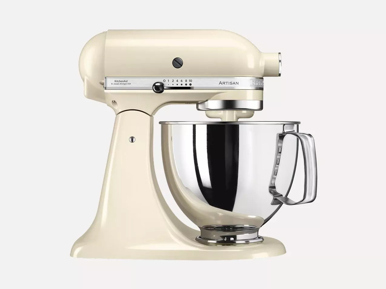 Cream KitchenAid Artisan stand mixer with stainless steel mixing bowl, side view on white background