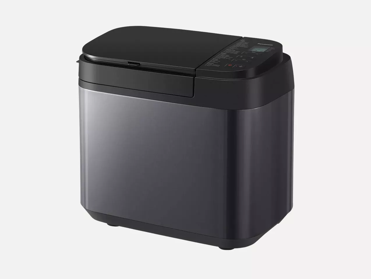 Black Panasonic bread maker machine with digital control panel and non-stick loaf tin, front view on white background