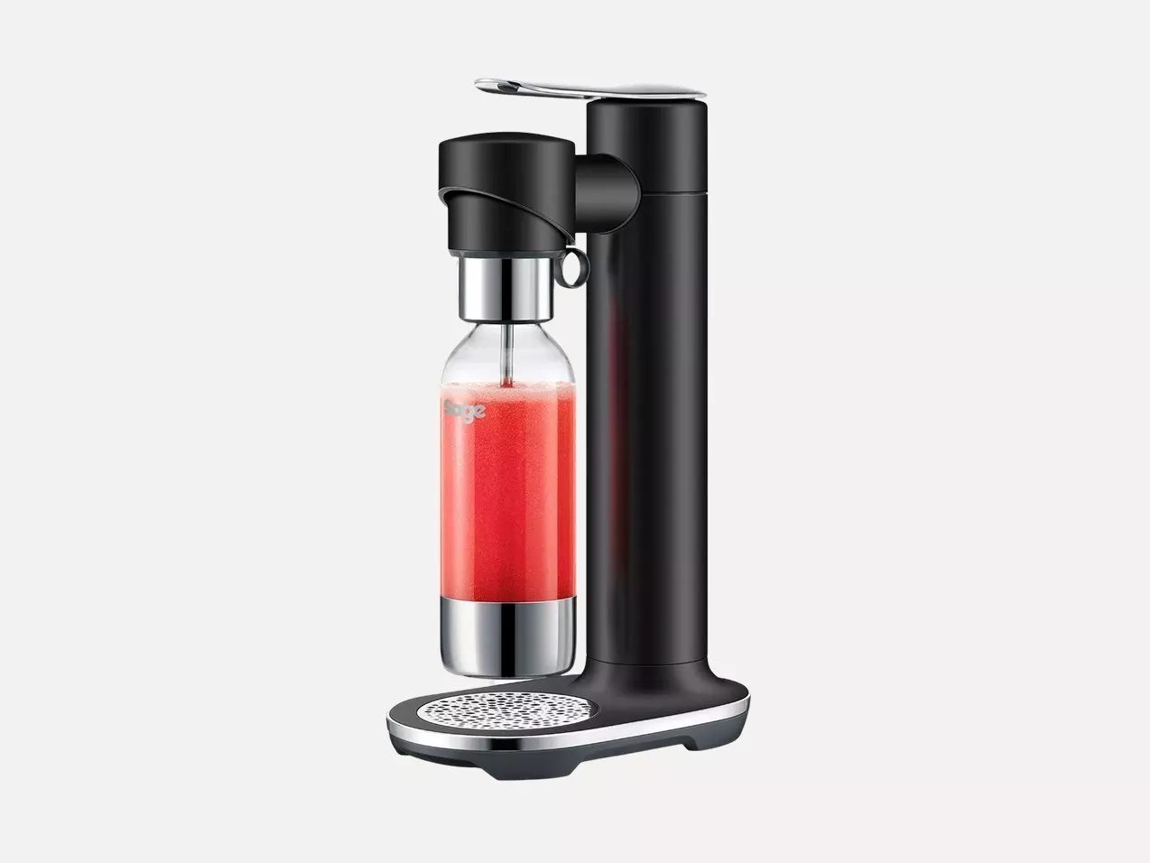 Black countertop sparkling water maker with glass bottle, carbonating red drink, modern home kitchen appliance