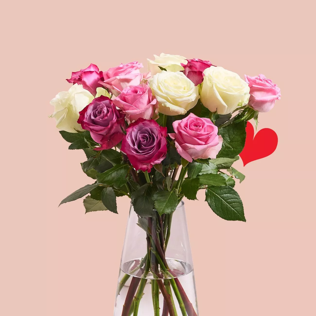 A bouquet of pink, white, and purple roses in a clear vase against a soft pink background with a red heart.