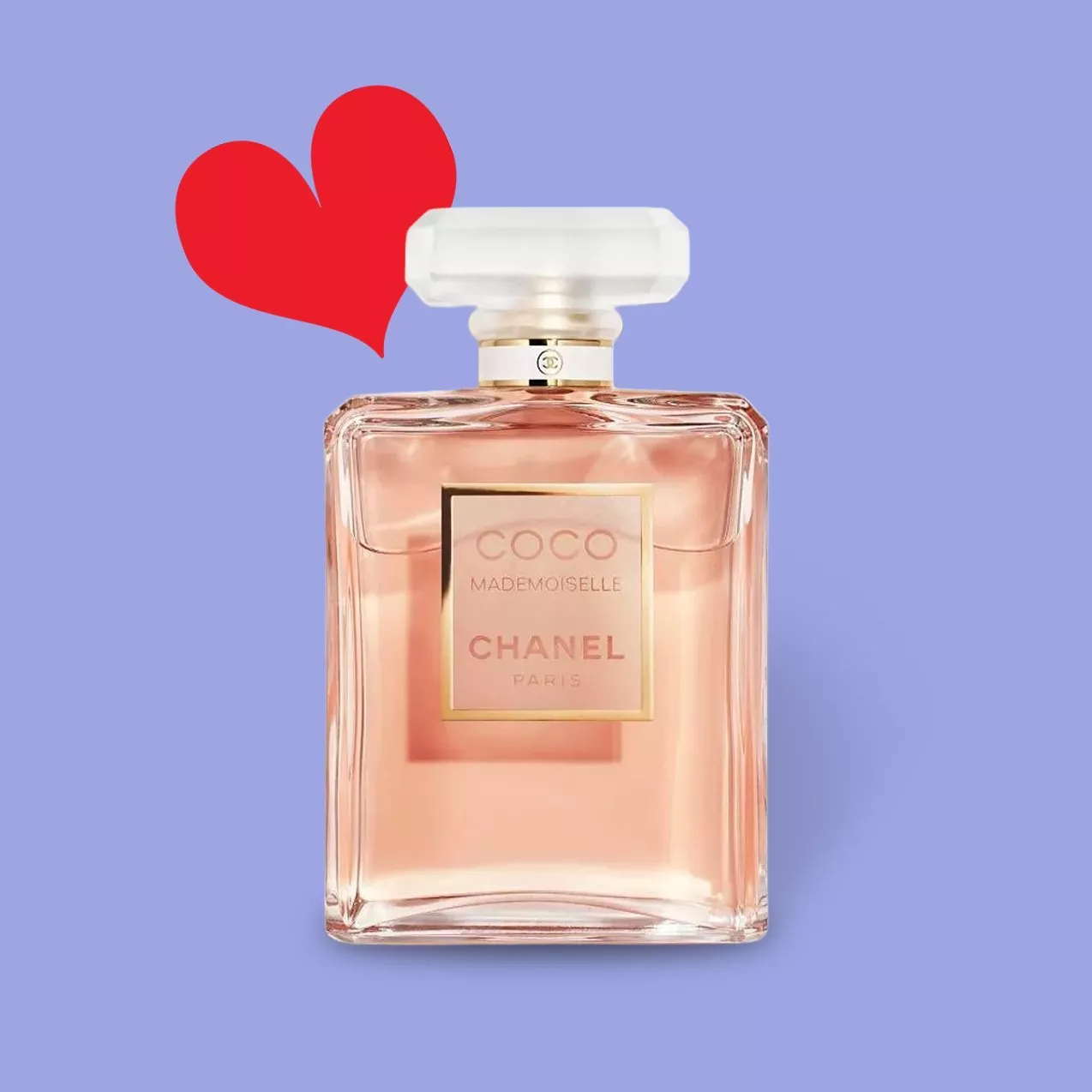 Chanel Coco Mademoiselle perfume bottle on a purple background with a red heart symbol nearby.