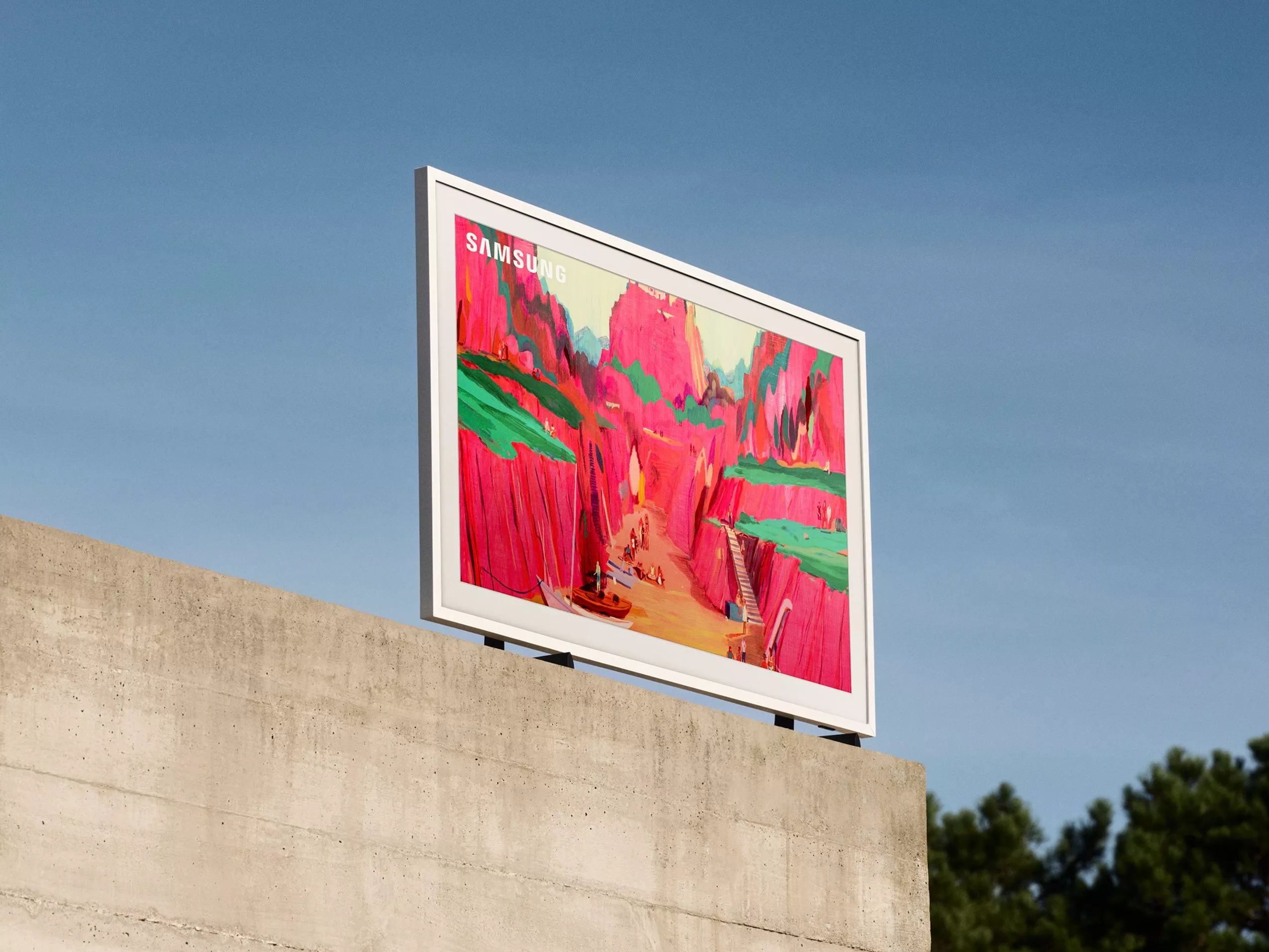 A Samsung TV on a concrete wall against a clear blue sky.
