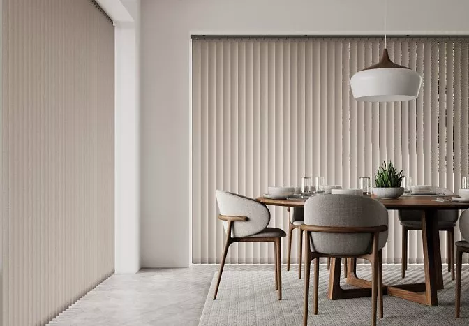 Dining room with floor length vertical blinds on the window