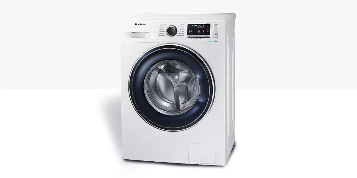 White Samsung front-loading washing machine with digital display and large door, modern laundry appliance product photo