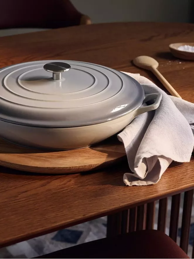 Le Creuset grey casserole dish on a table 