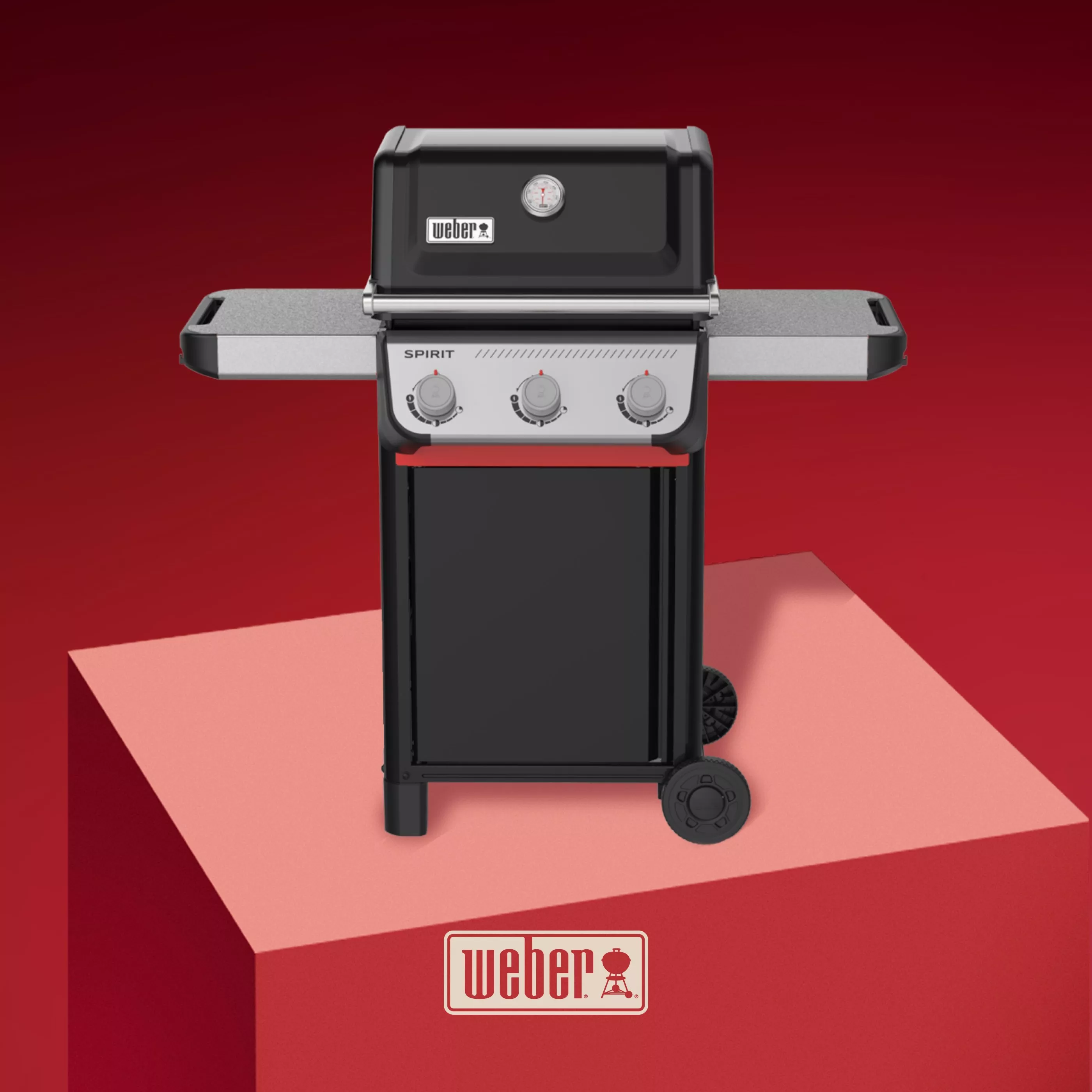 Weber Spirit three-burner gas barbecue grill with side shelves and wheels, studio product shot on red backdrop