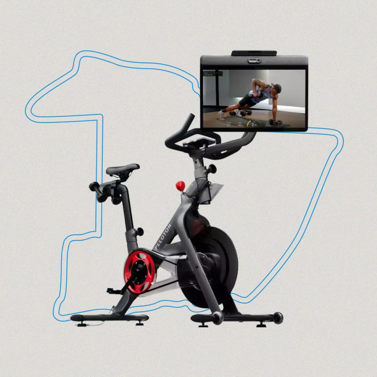 A Peloton stationary exercise bike positioned against a light gray background.