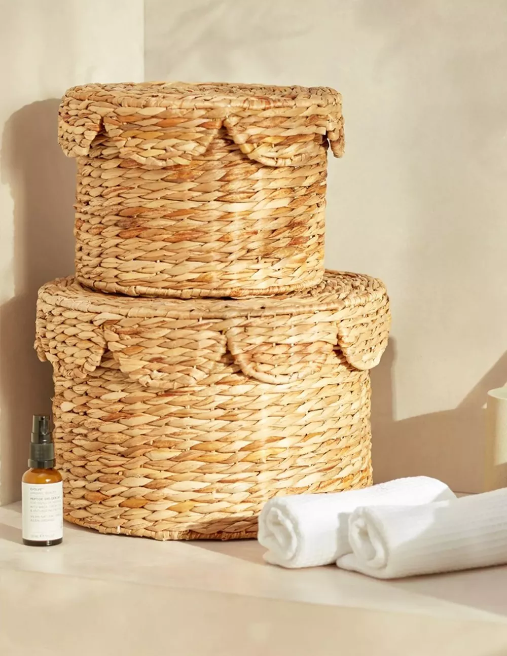 baskets with white towels and a beauty product