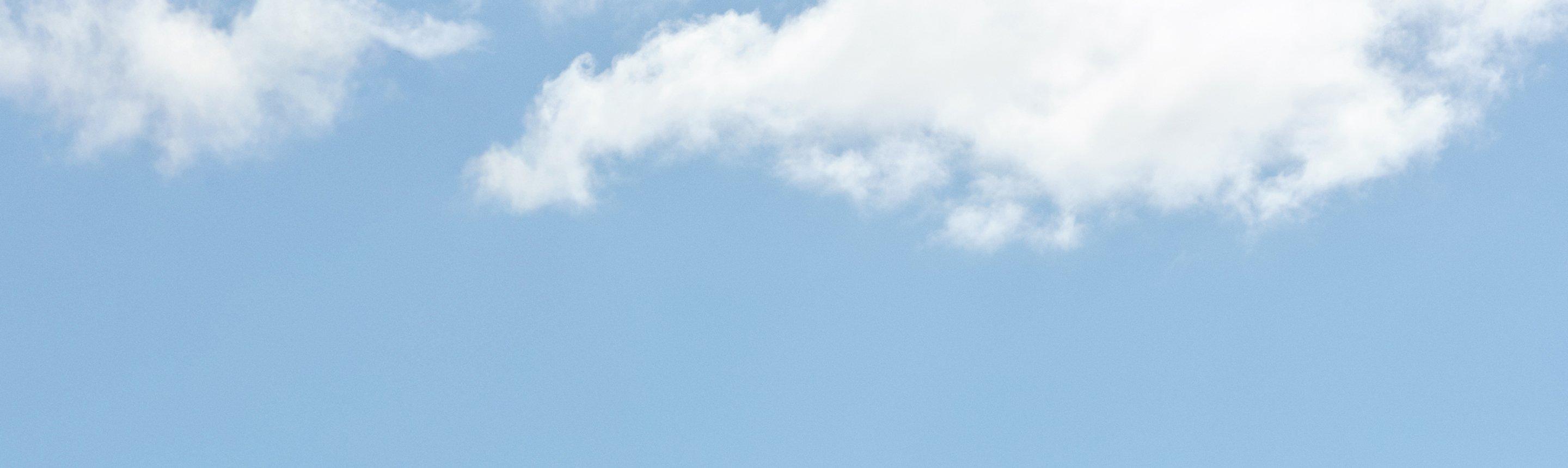 Blue sky with scattered white clouds