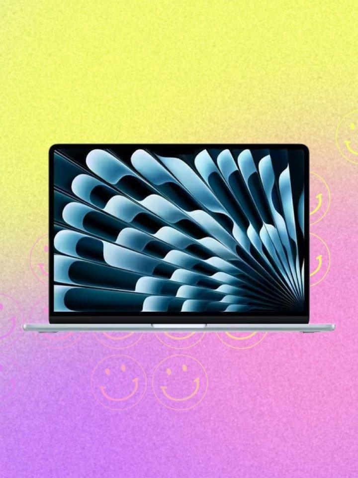 Macbook Air in front of a vibrant yellow and purple gradient background.