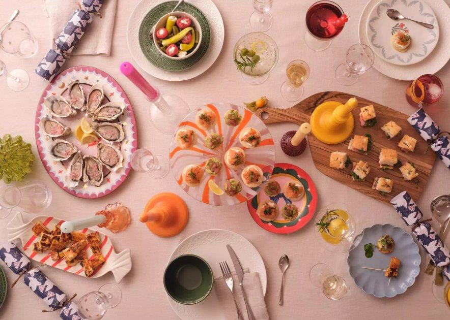 Christmas table setting with a selection of party food