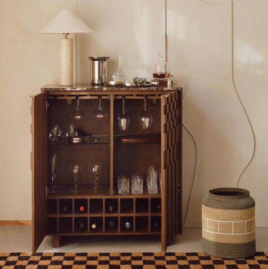 A desk and chair accompanied by a storage shelving unit