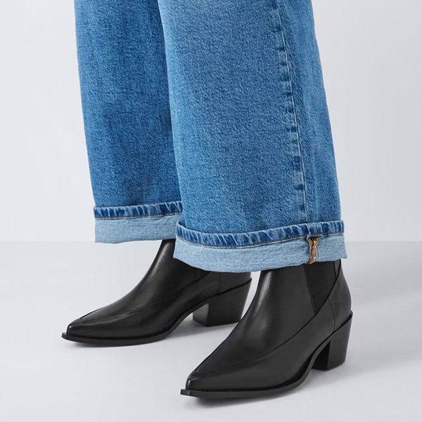 women wearing Chelsea Boot with blue jeans on top