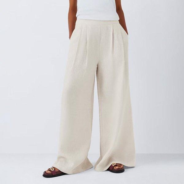 Beige wide-leg linen trousers.