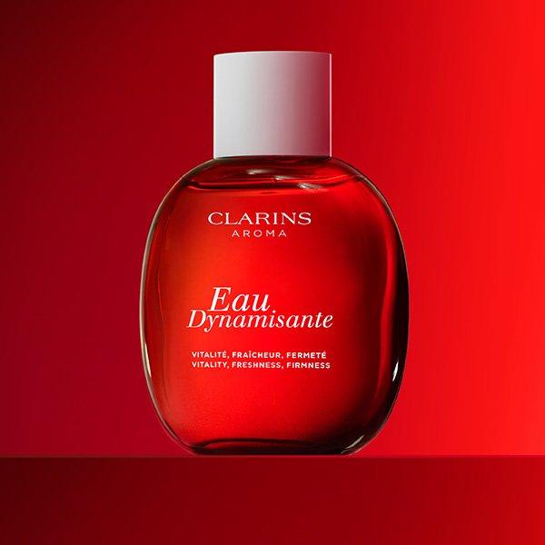 womens fragrance clarins aroma with red background