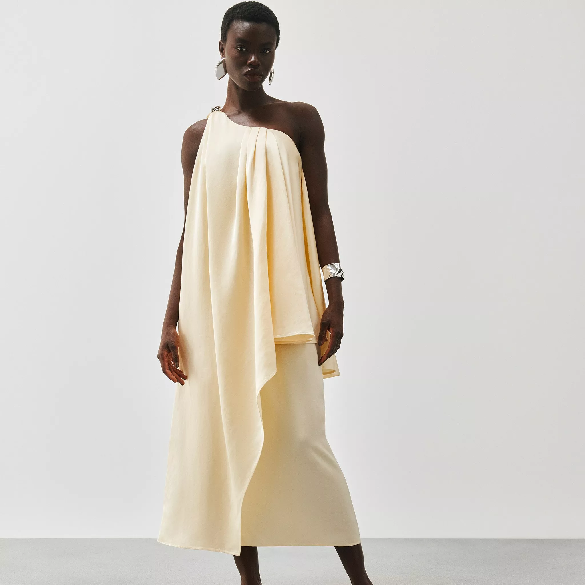 woman wearing yellow occasion dress