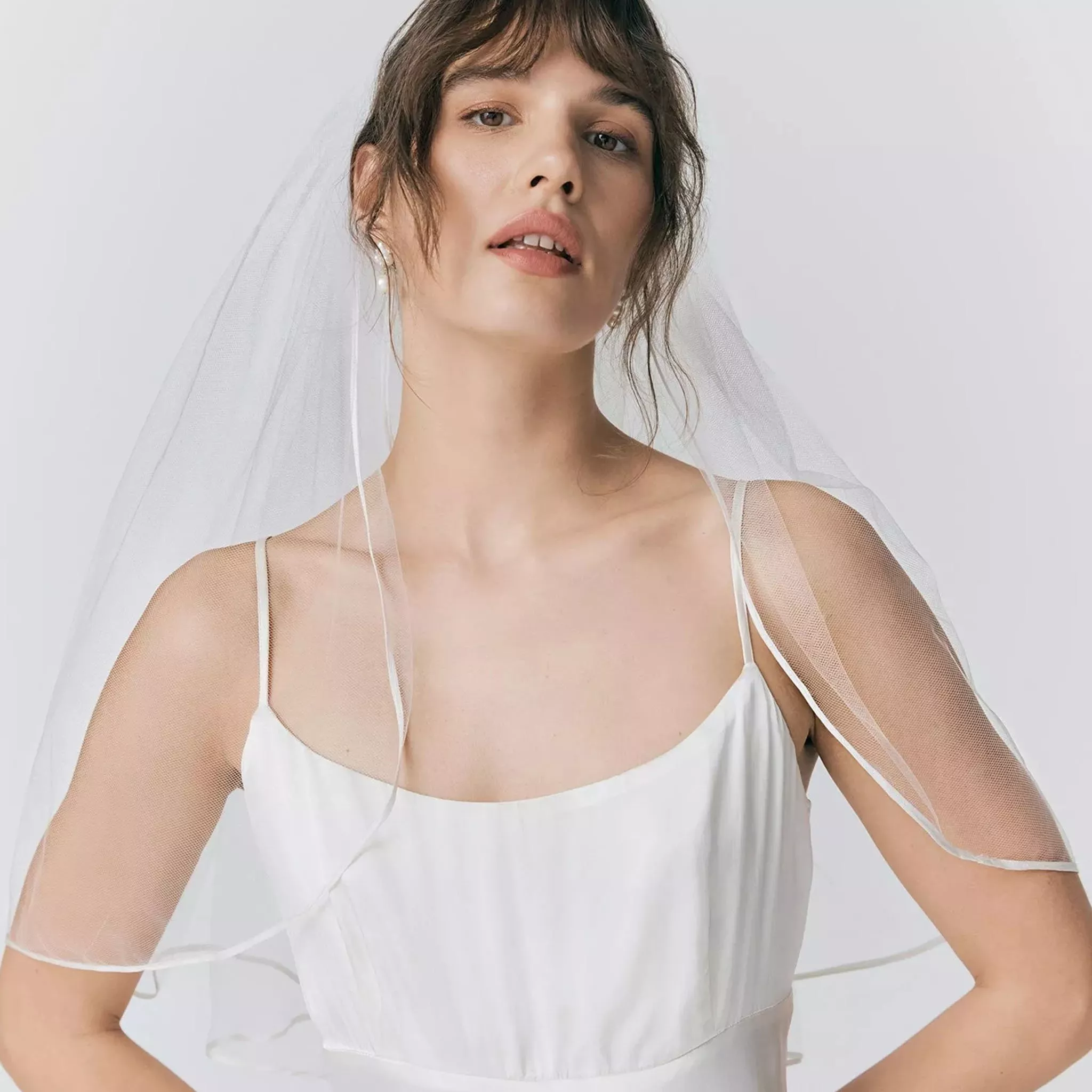 woman wearing wedding dress and veil 