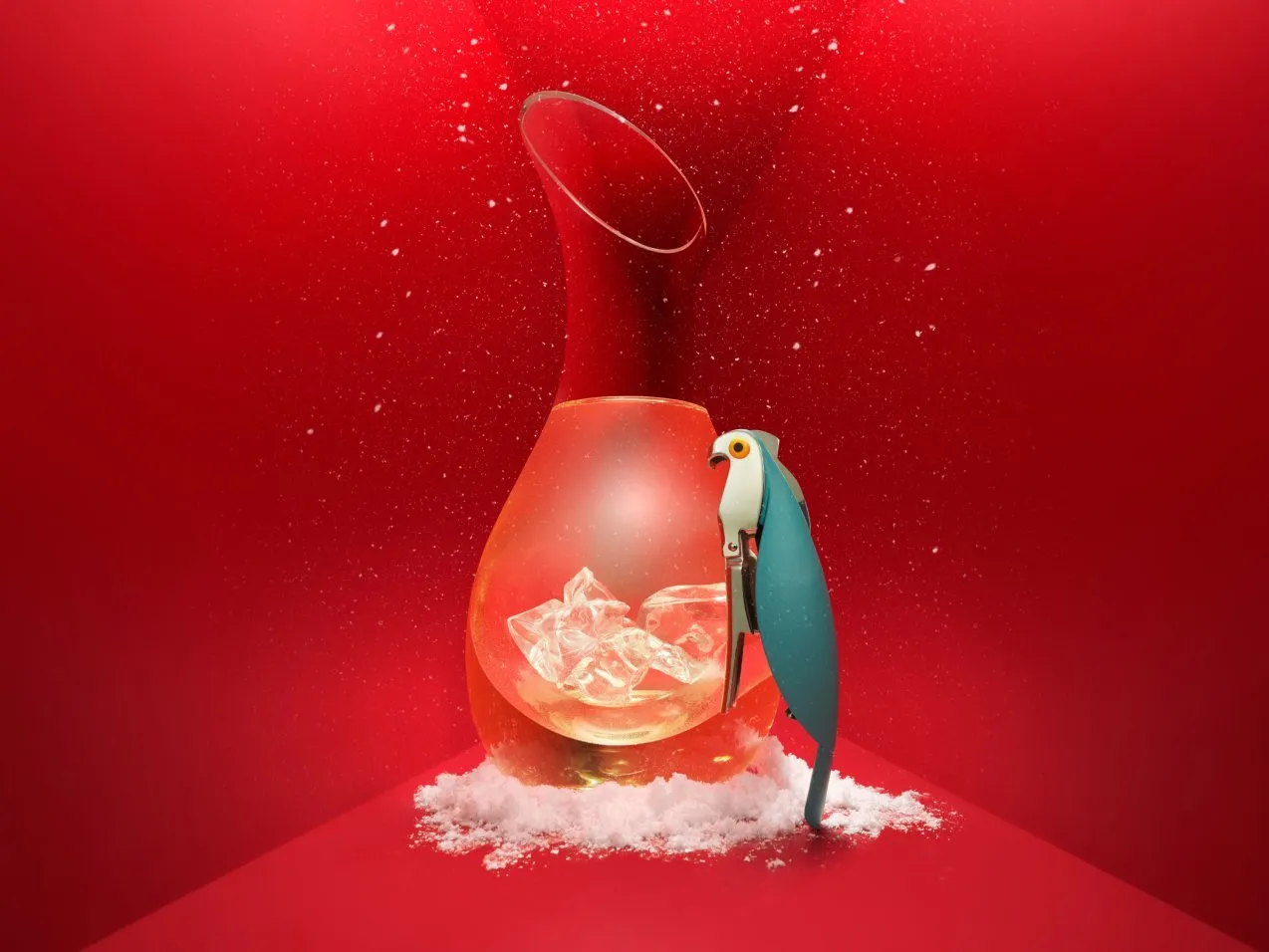 Blue parrot corkscrew beside a glass decanter with ice on snow, set against a bold red background.