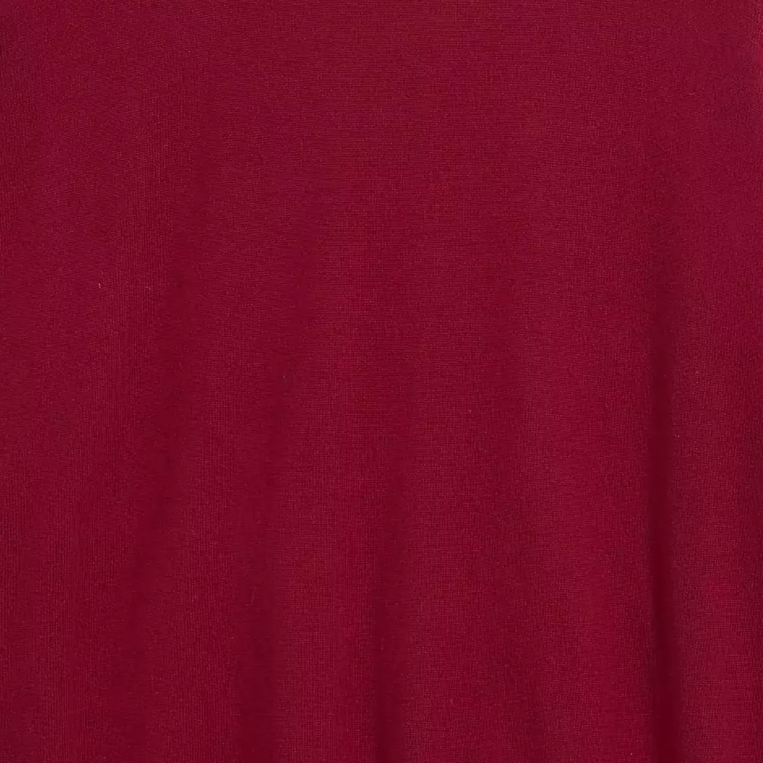 Close-up of burgundy red fabric texture, smooth knit material background for clothing and textiles